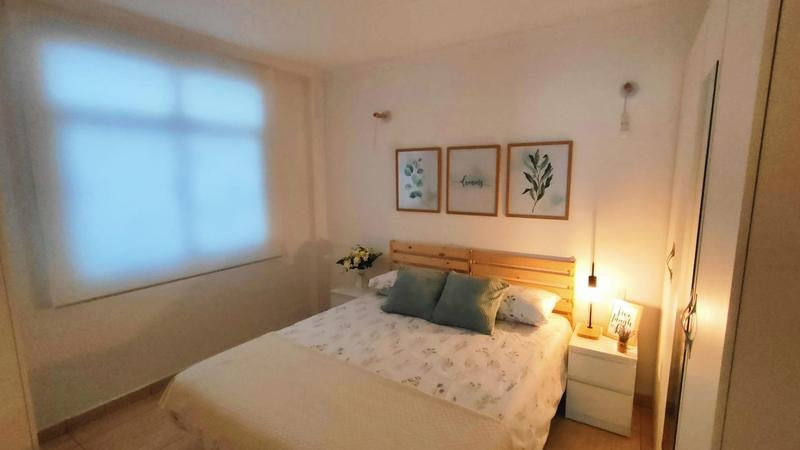 Caledonia Park Beachfront Luxury Apartment bedroom with queen-size bed 2