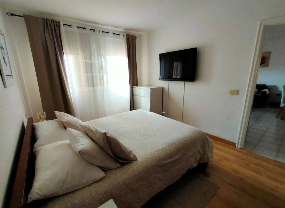Costa Adeje Balcon del Atlantico Magnificent Apartment Bedroom with queen-size bed and large window