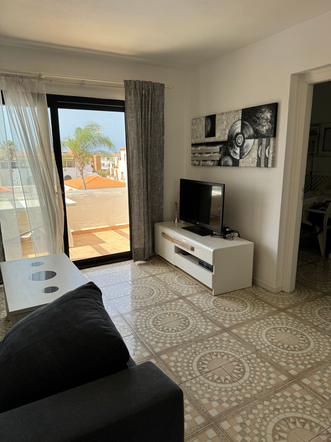 Cozy long term rent Amarilla Apartment Tenerife living room with a flat-screen tv
