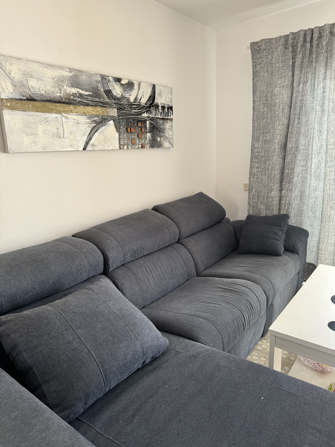 Cozy long term rent Amarilla Apartment Tenerife living room with a large sofa