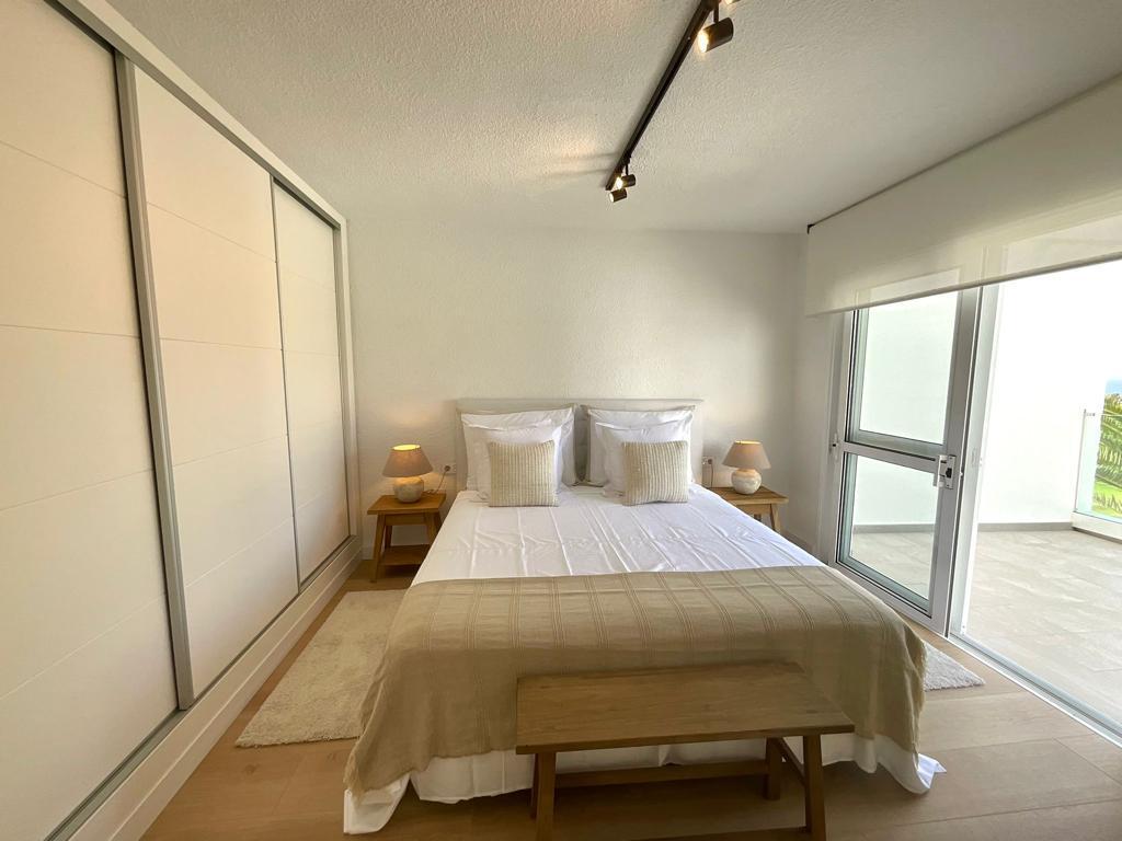 Golf Costa Adeje Luxury Villa Elegant bedroom with queen-size bed and large windows