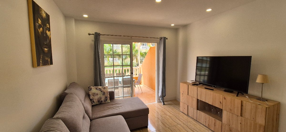 Palm Mar Unique Apartment Primavera Complex spacious living room with large full-screen tv