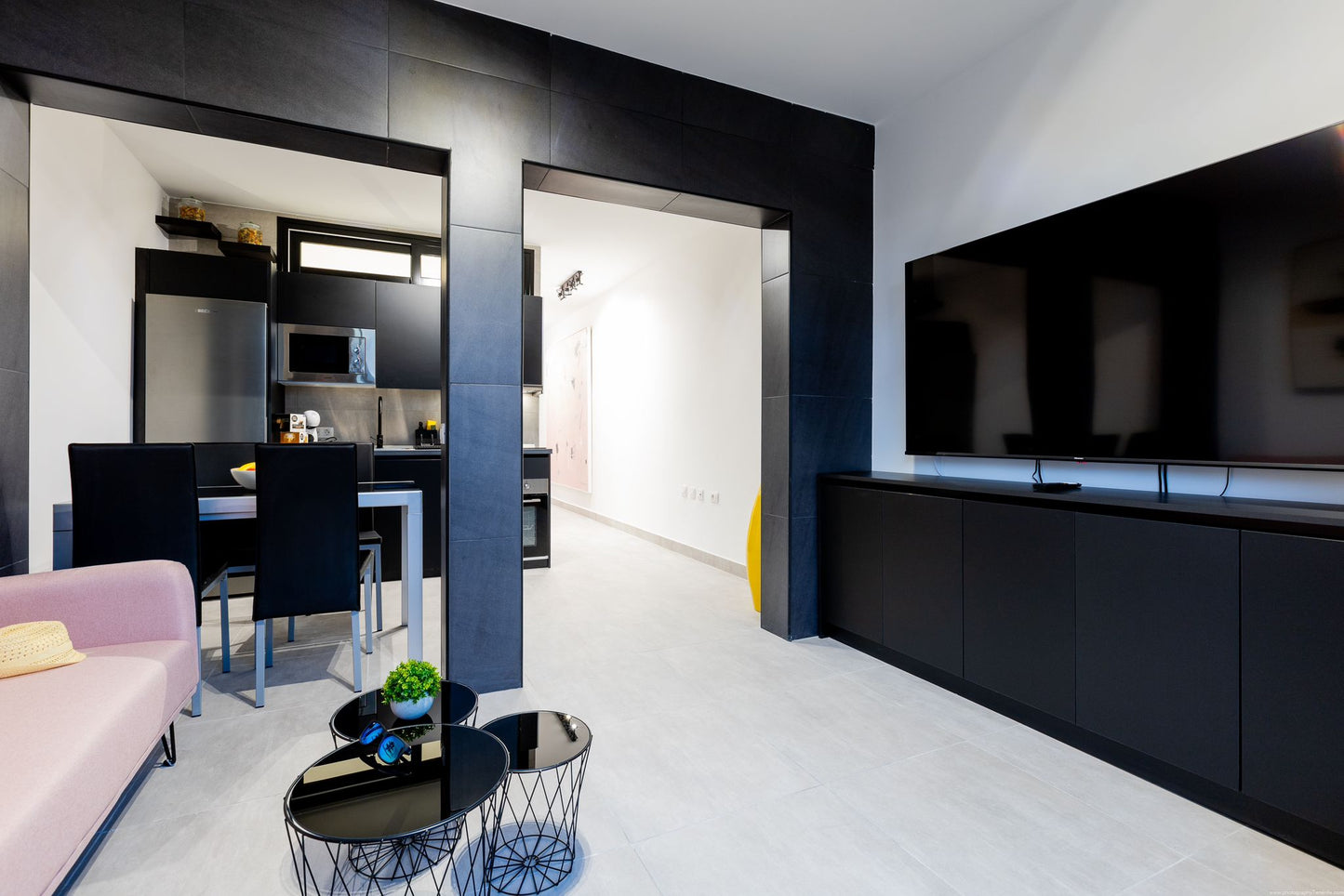 Spacious 2-Bedroom Apartment for Sale in Playa Paraíso Minimalist living room with comfortable seating and maxi flat screen tv