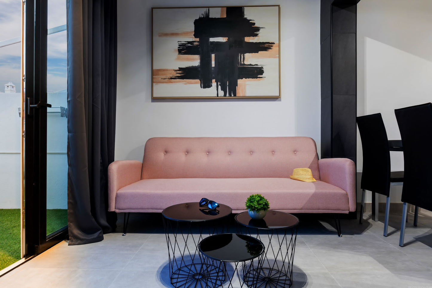 Spacious 2-Bedroom Apartment for Sale in Playa Paraíso Minimalist living room with comfortable seating and pink sofa
