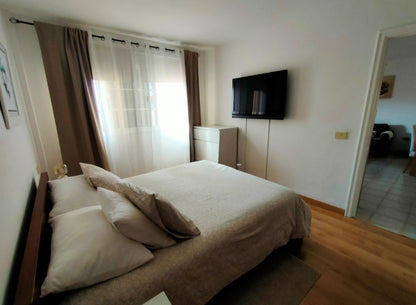 Costa Adeje Balcon del Atlantico Magnificent Apartment Bedroom with queen-size bed and large window
