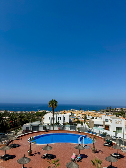Costa_Adeje_Charming_Renovated_Apartment_complex_pool_sea_view_beach_chair_umbrella