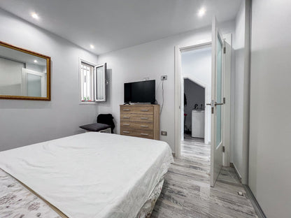 Costa Adeje Mareverde Fanabe Unique Apartment cozy bedroom with queen-size bed and flat-screen tv