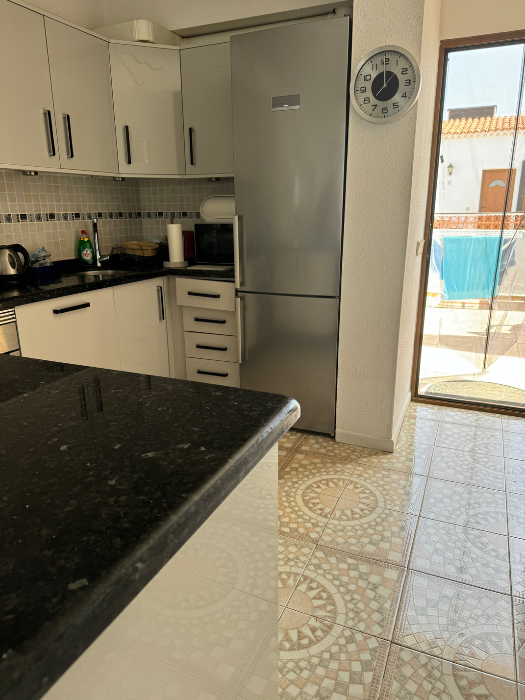 Cozy long term rent Amarilla Apartment Tenerife living room with a fully equipped kitchen