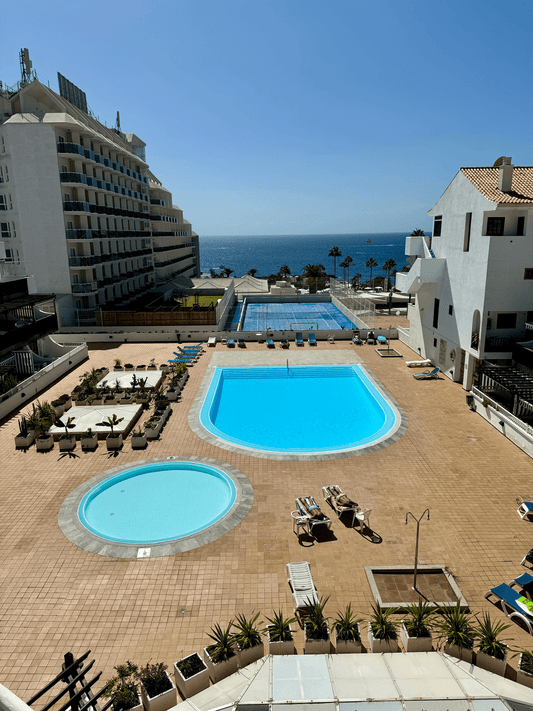 Fanabe_Stunning_Beachfront_Penthouse_Parque_Royal_Tenerife_terrace_pools_view