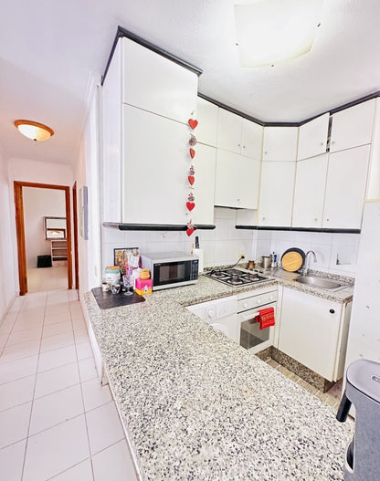 Heart of Los Cristianos Apartment Tenerife modern open plan kitchen microwave