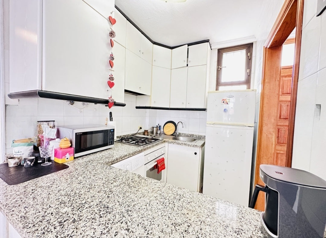Heart of Los Cristianos Apartment Tenerife modern open plan kitchen microwave coffee machine 