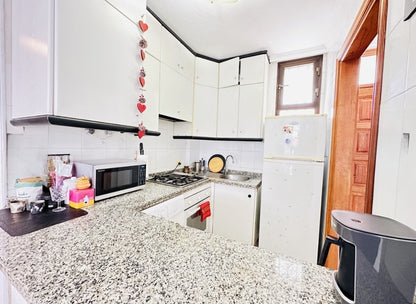 Heart of Los Cristianos Apartment Tenerife modern open plan kitchen microwave coffee machine 