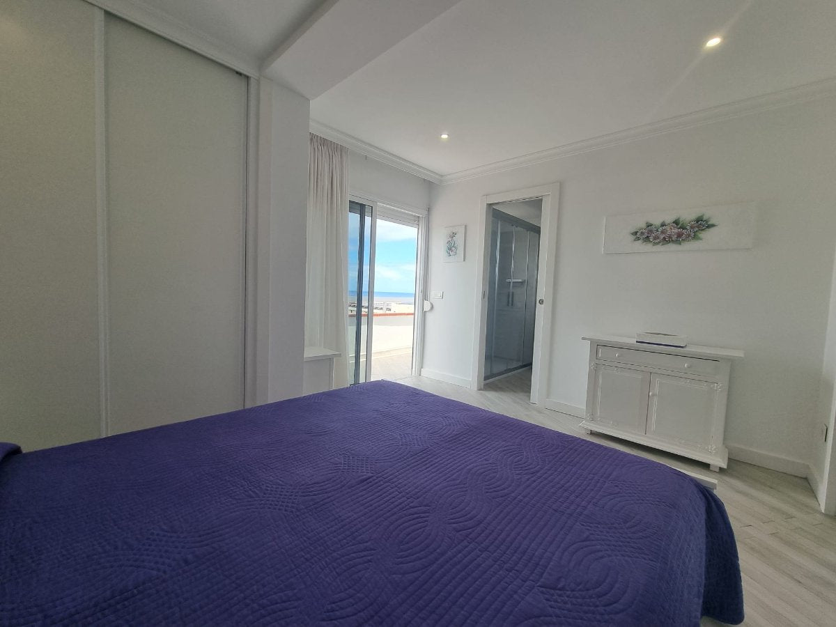Las Americas Unique Penthouse View stylish bedroom with queen-size bed and modern amenities
