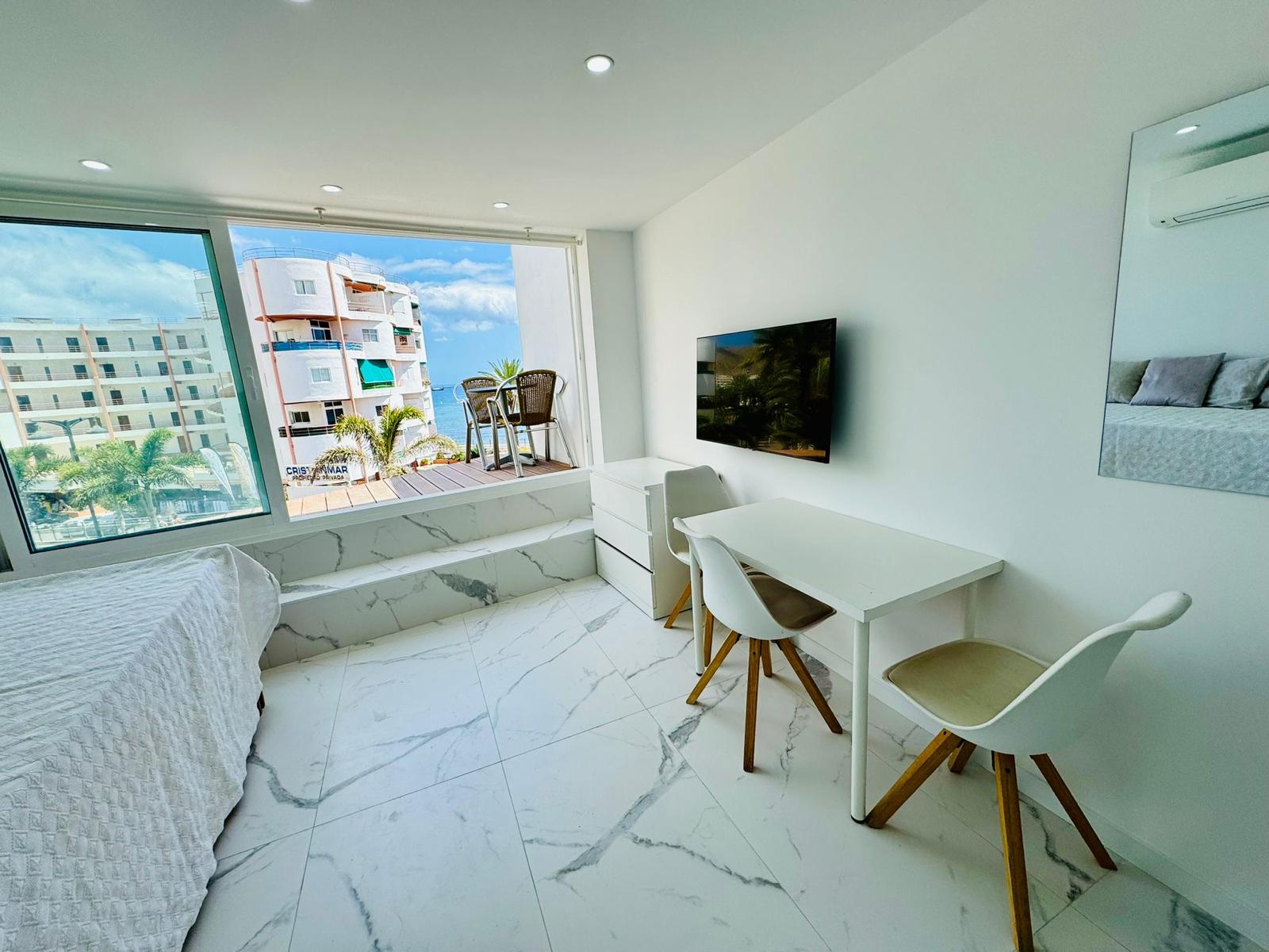 Los_Cristianos_Must-See_Beachfront_Apartment_with_Stunning_Ocean_Views_in_Tenerife_living_room_mirror