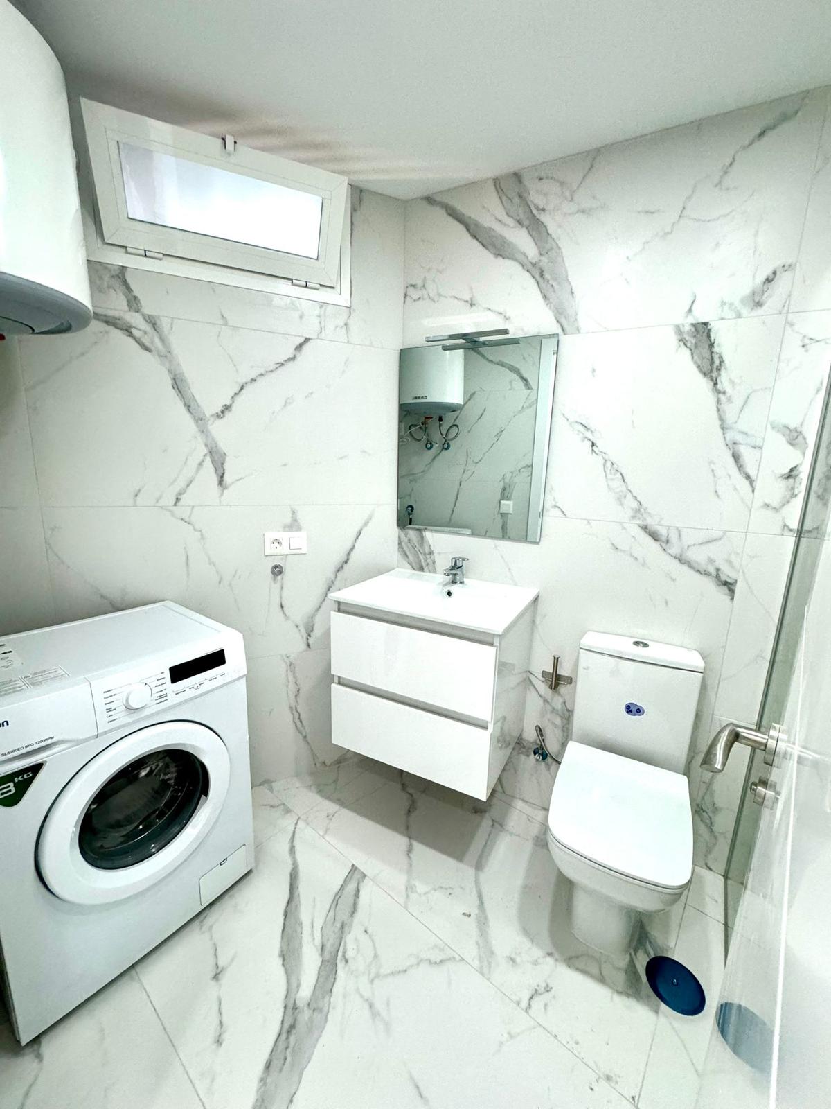 Los_Cristianos_Must-See_Beachfront_Apartment_with_Stunning_Ocean_Views_in_Tenerife_marble_bathroom
