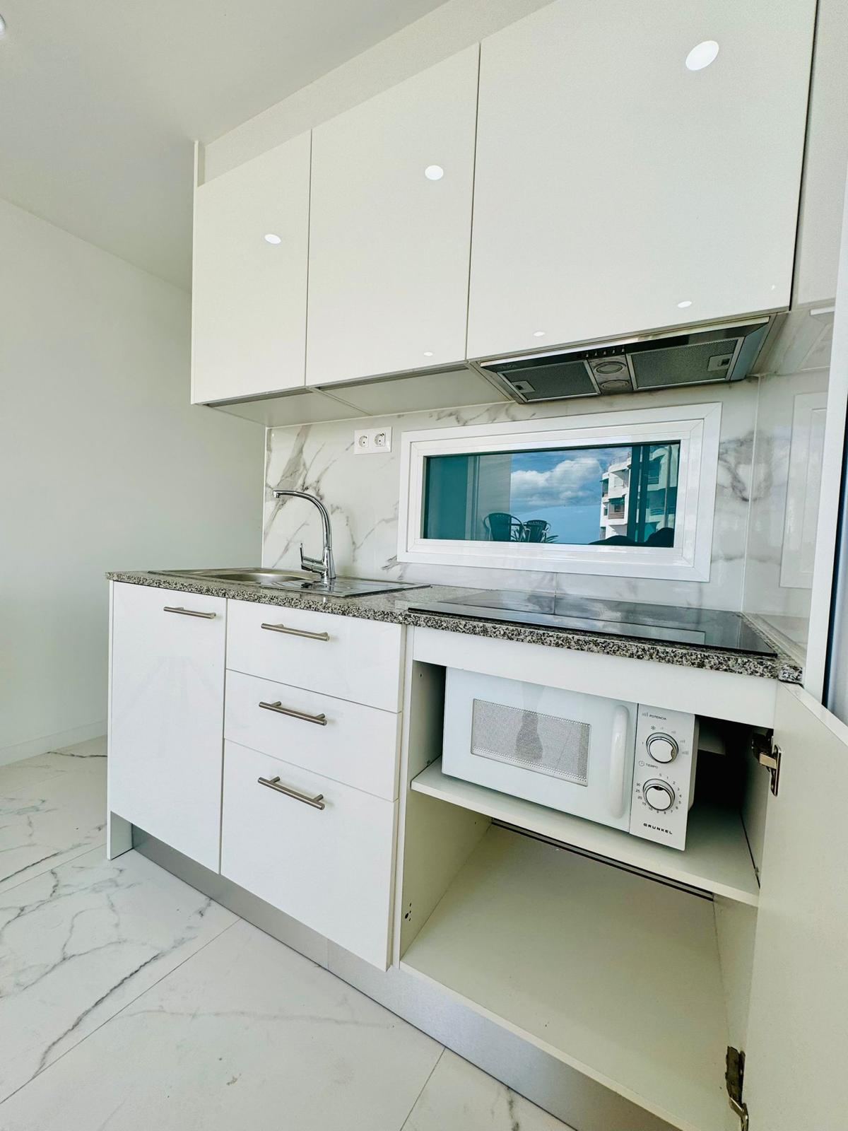Los_Cristianos_Must-See_Beachfront_Apartment_with_Stunning_Ocean_Views_in_Tenerife_microwave