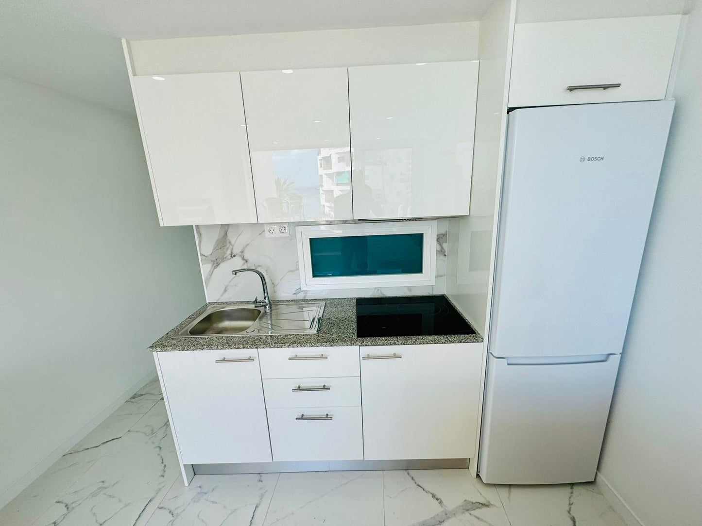 Los_Cristianos_Must-See_Beachfront_Apartment_with_Stunning_Ocean_Views_in_Tenerife_new_marble_kitchen_renovated