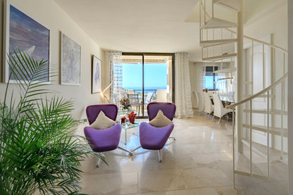 Pal Mar La Arenita Spacious Duplex Penthouse elegant dining room with violet contemporary chairs