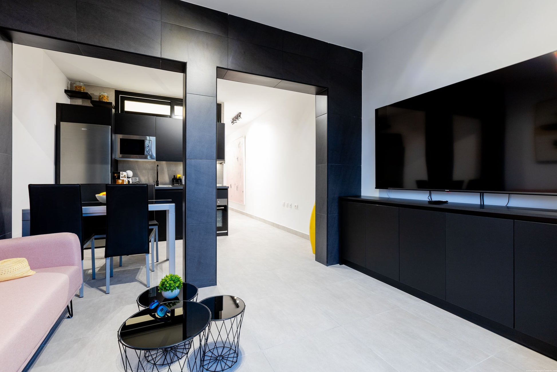Spacious 2-Bedroom Apartment for Sale in Playa Paraíso Minimalist living room with comfortable seating and maxi flat screen tv