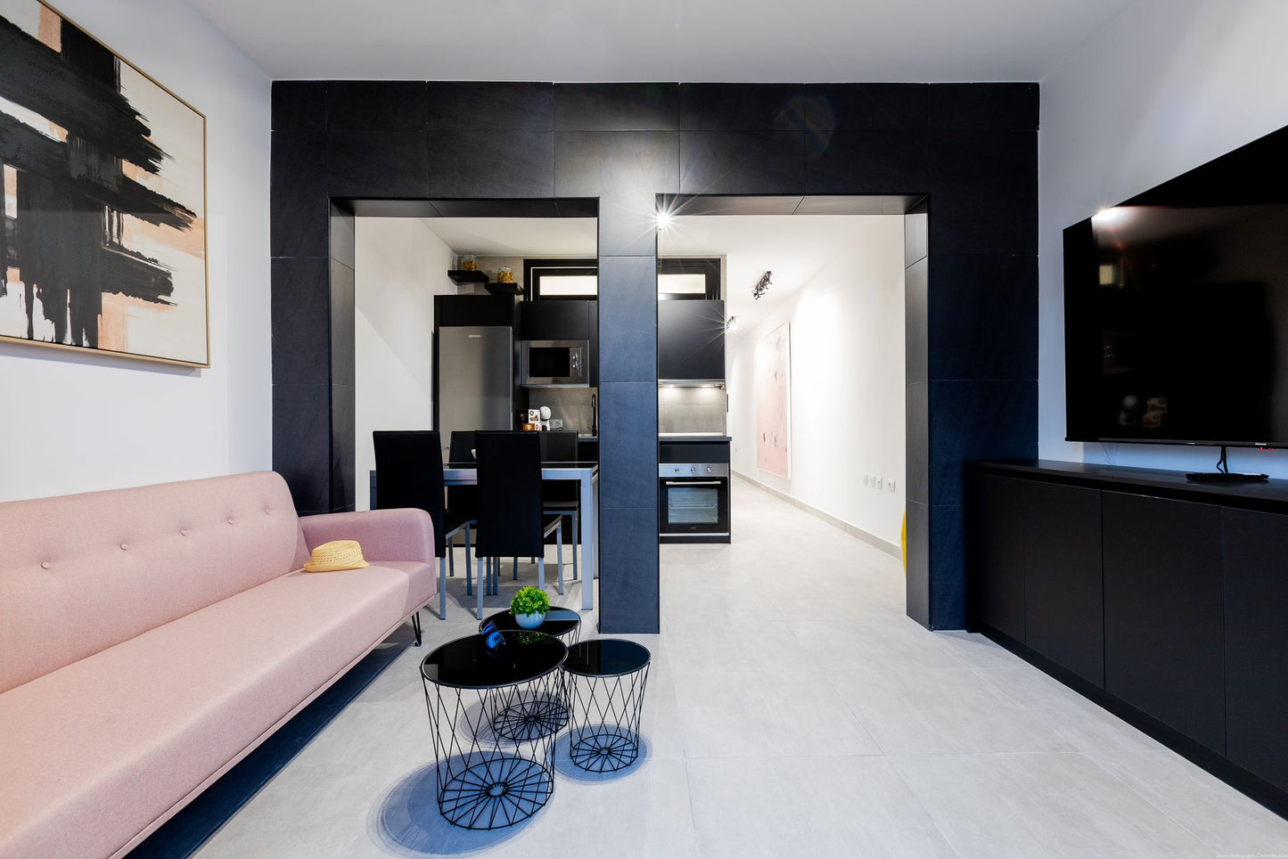 Spacious 2-Bedroom Apartment for Sale in Playa Paraíso Minimalist living room with comfortable seating and maxi flat screen tv 2