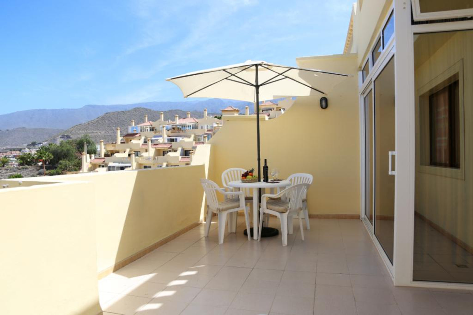 Torviscas_Fantastic_Apartment_with_Pool_and_Private_terrace_chairs_table_outside
